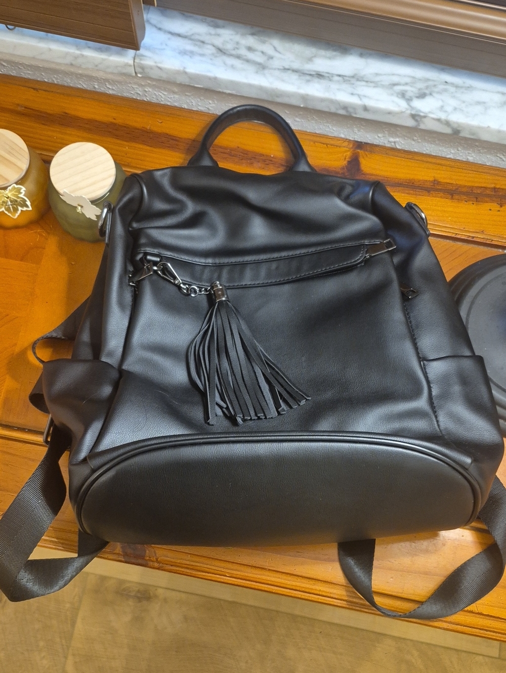 Classic Black Faux Leather Backpack with Tassel Accent